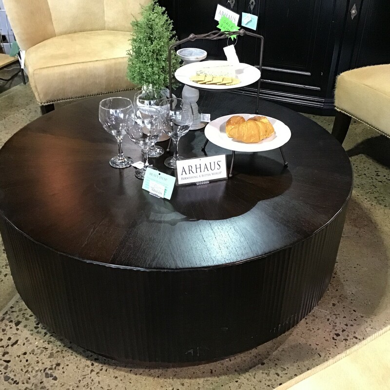 This is the most interesting coffee table we have ever had! It is finished in an espresso stain, is round and SPINS! Crafted by Arhaus, this table has so many fun functions!  Image serving snackies on it or playing games or doing puzzles!  Great piece for in between a bunch of chairs, in front of a sectional or sofa!

Dimensions are 45 in x 45 in x 16 in