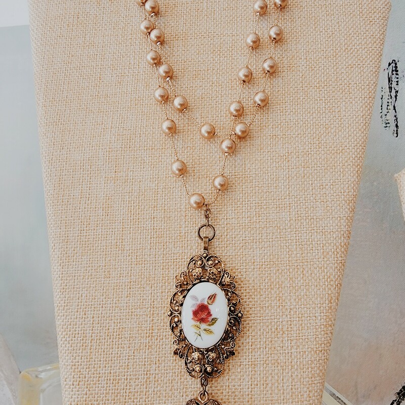 This lovely necklace handmade by Kelli Hawk Designs has two layers of gold beads and vintage pieces as the pendant! The necklace is 16 inches.