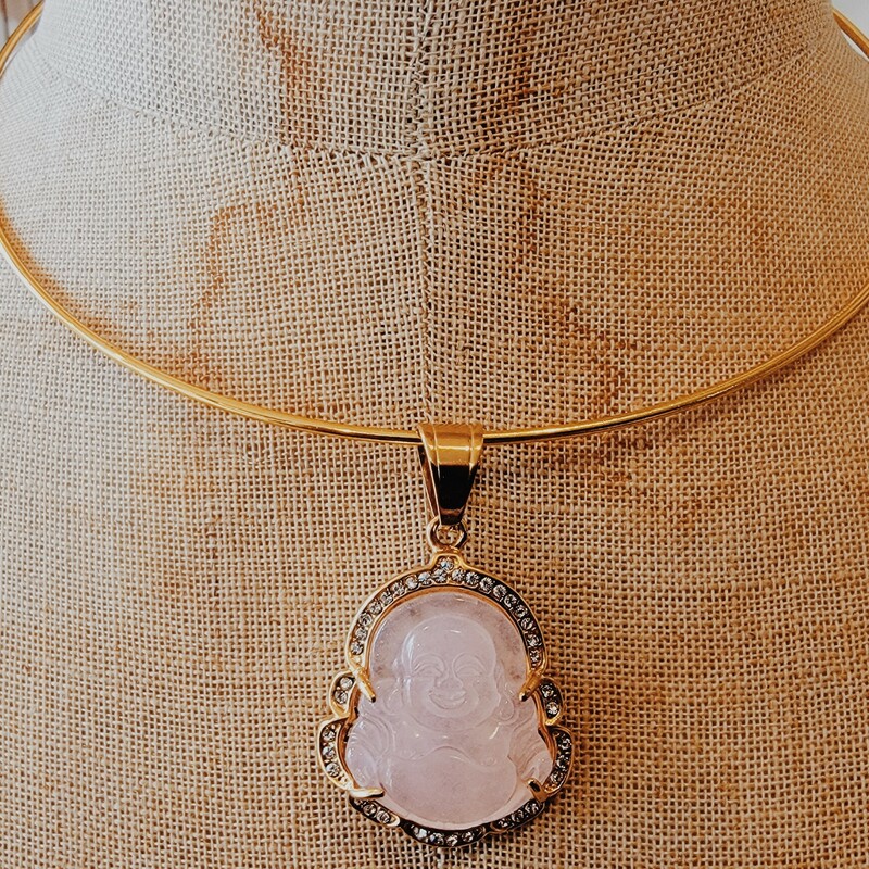 This beautiful gold choker has a pink buddah hanging with a gold border. Such a cute piece for layering!