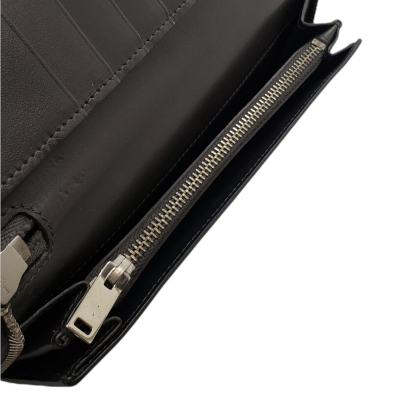 Saint Laurent<br />
<br />
YSL Embossed Long Wallet<br />
<br />
Oversized for extra card holders<br />
<br />
Condition: Excellent. A Few Marks from zipper. Corners