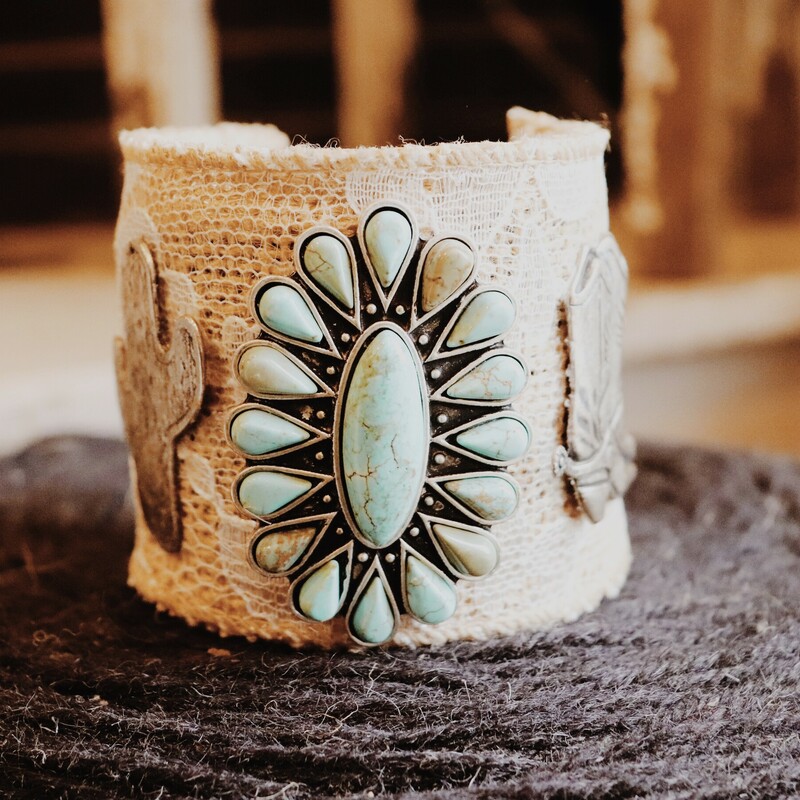 This adorable burlap and lace cuff meaures 2.5 inches in diameter and has a turquoise center with cowgirl boots on one side and a cactus on the other!