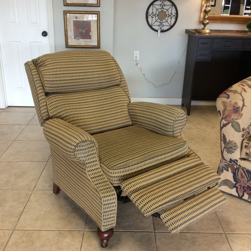 This is a nice recliner by Lane Furniture. Upholstered in  a gold and navy pattern with manual operation.