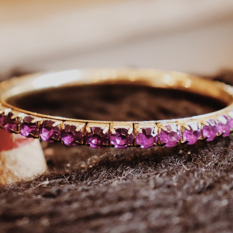 This simple purple bangle is perfect for stacking! It measures 3 inches in diameter.