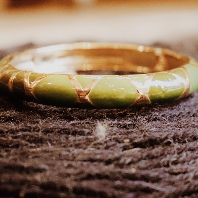This green and gold bangle measures 2.5 inches in diameter and is perfect for stacking!