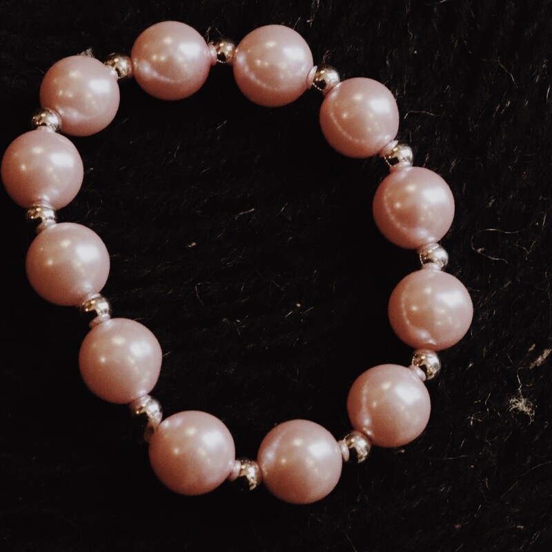 This stretchy pink bracelet fits most sizes!