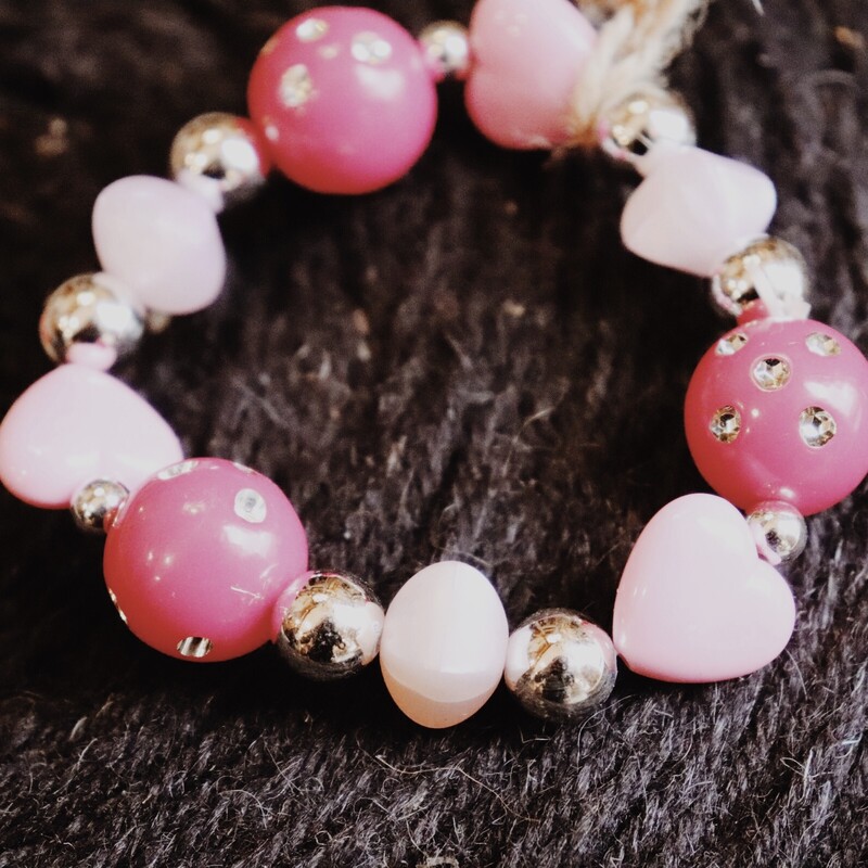 This pink bracelet is on a stretchy cord for a wide variety of sizes!