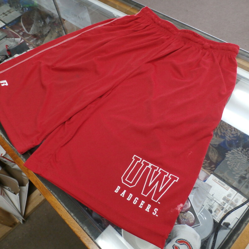 Russell Men's Wisconsin Badgers shorts red size Small polyester #33419<br />
Rating: (see below) 4- Fair Condition<br />
Team: Wisconsin Badgers<br />
Player: Team<br />
Brand: Russell<br />
Size: Men's    Small-  (Measured Flat: Waist 13\"; Length 21\"; Inseam 9\")<br />
Measured flat: hip to hip; hip to hem; and groin to hem<br />
Color: Red<br />
Style: elastic waistband; screen pressed; shorts<br />
Material: 100% polyester<br />
Condition: 4- Fair Condition: wrinkled; minor pilling and fuzz; some stretching from use; there is both white and dark staining in multiple spots on shorts;<br />
Item #: 33419<br />
Shipping: FREE