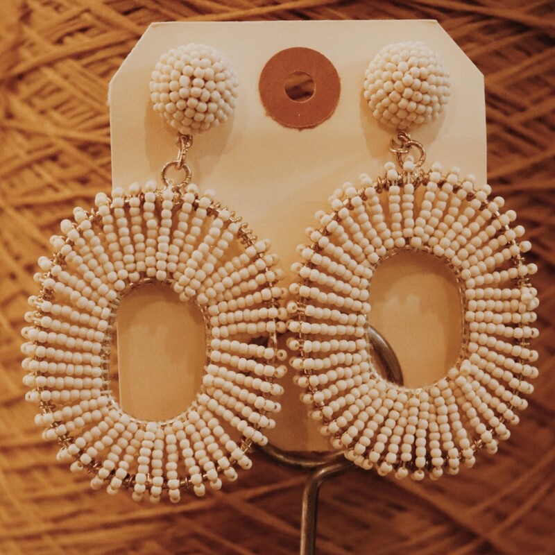 These beautiful cream colored earrings measure about 3 inches long!
