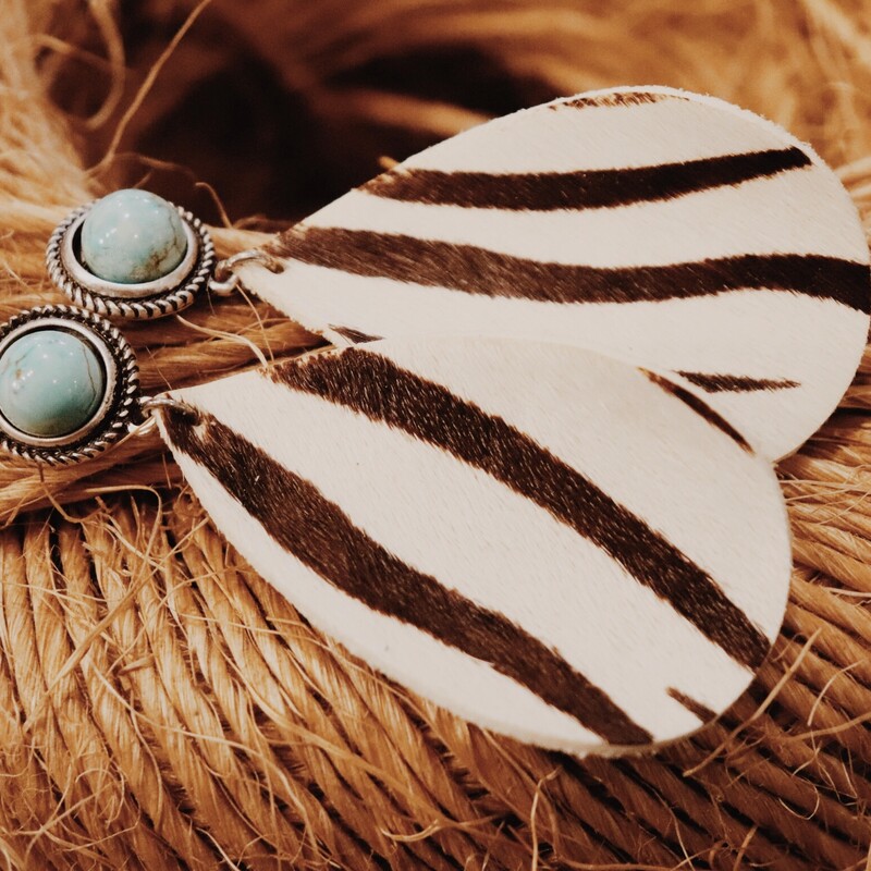 These earrngs have a turquoise circle post attached by a cowhide teardrop zebra stripe that is brown/cream in color. They are light weight. 3 long.
