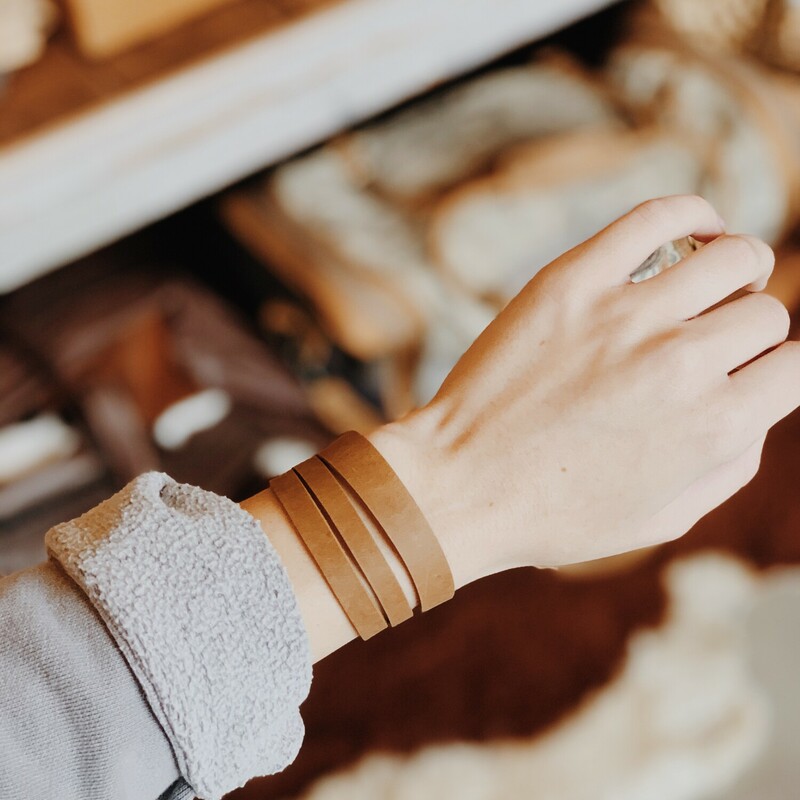 This cuff bracelet from The Olive Branch was carefully designed, hand crafted, and was made from genuine leather! The bracelet measure 8 inches long and has two connectors for adjustability.