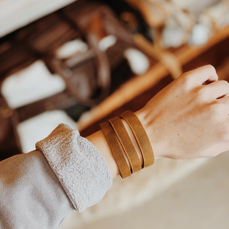 This cuff bracelet from The Olive Branch was carefully designed, hand crafted, and was made from genuine leather! The bracelet measure 8.75 inches long and has two connectors for adjustability.