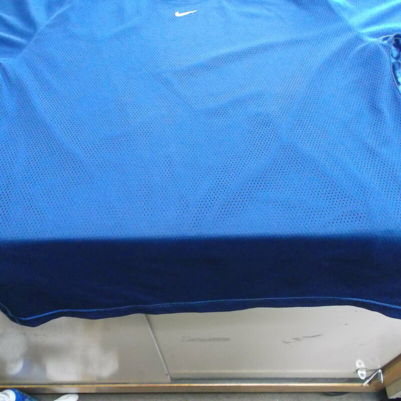 Nike Men's Mesh Short Sleeve Basketball Shirt Size XL Blue Polyester #9277
Rating:   (see below) 3 - Good Condition
Team: N/A 
Event: n/a  
Brand: Nike
Size: XL - Men's(Measured Flat: Across Chest 24\"; Length 31\") armpit to armpit & shoulder to bottom hem
Color: Blue
Style: Mesh short sleeve basketball shirt
Material: 100 Polyester
Condition: - Good Condition (GUC)- wrinkled; Material looks and feels good; few light snags; No stains or rips(Please use photos to see the condition details) 
Shipping cost: $4.62
Item #: 9277