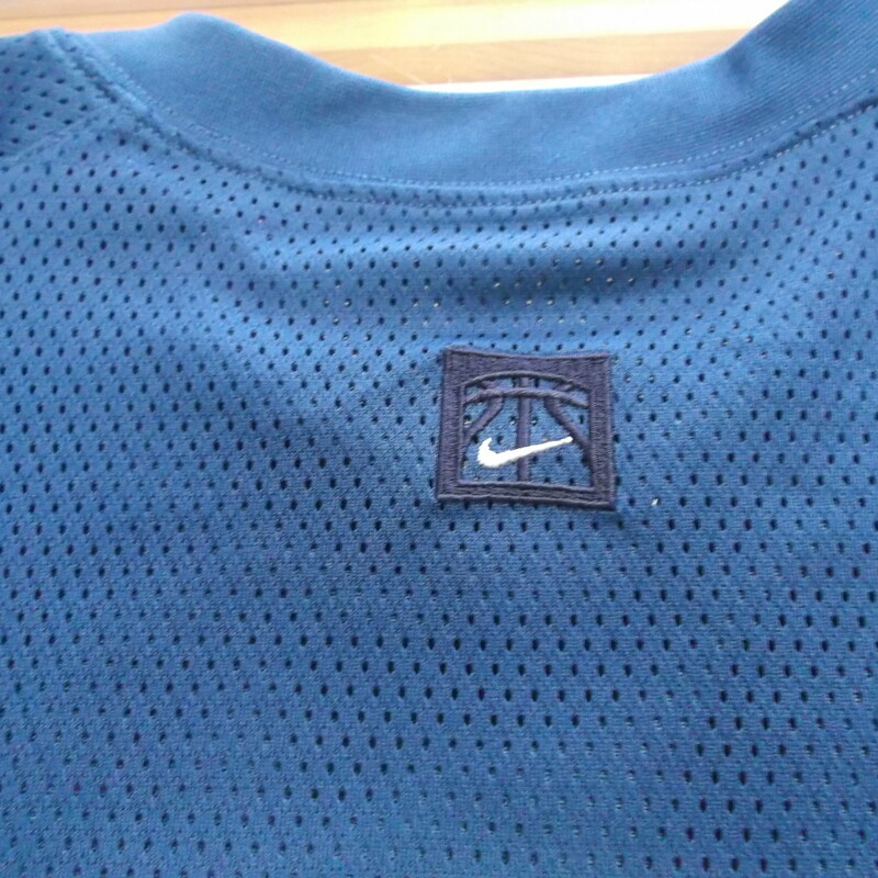 Nike Men's Mesh Short Sleeve Basketball Shirt Size XL Blue Polyester #9277<br />
Rating:   (see below) 3 - Good Condition<br />
Team: N/A <br />
Event: n/a  <br />
Brand: Nike<br />
Size: XL - Men's(Measured Flat: Across Chest 24\"; Length 31\") armpit to armpit & shoulder to bottom hem<br />
Color: Blue<br />
Style: Mesh short sleeve basketball shirt<br />
Material: 100 Polyester<br />
Condition: - Good Condition (GUC)- wrinkled; Material looks and feels good; few light snags; No stains or rips(Please use photos to see the condition details) <br />
Shipping cost: $4.62<br />
Item #: 9277