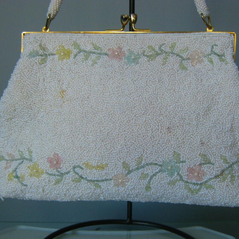 Vtg GMB Beaded, Pink/Wh, Size: None<br />
This is a pretty white beaded frame bag with lines of pink and yellow flowers worked along the top and bottom edge on both front and back.<br />
gold kiss lock frame with jeweled 'kisses' so cute<br />
Pristine white satin lining with one slip pocket<br />
White beaded handle<br />
handmade in Hong Kong by GMB<br />
<br />
Excellent like new condition except there is one tiny spot where the white beads have a brown cast as shown.<br />
<br />
Width 9.75<br />
Height: 6.5<br />
Depth: 1.75<br />
Handle Drop: 5.75<br />
<br />
thanks for looking!<br />
#43959