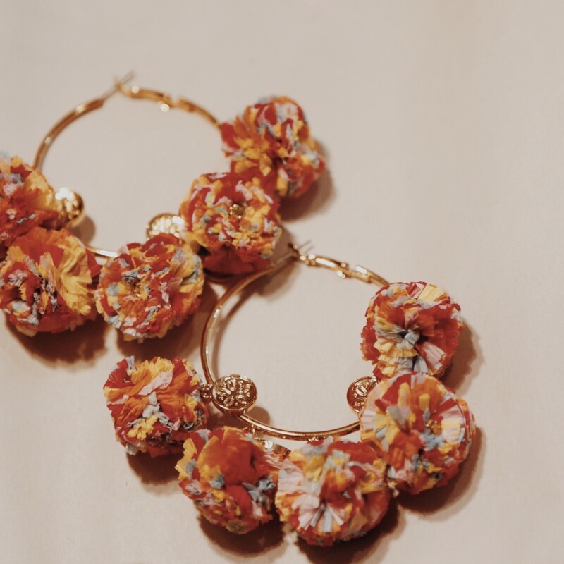 These adorable pom pom hoops measure 3 inches long!
