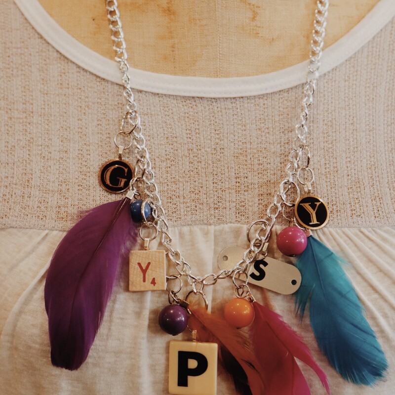This fabulous necklace spells out gypsy in game piece and is on a 28 inch chain!