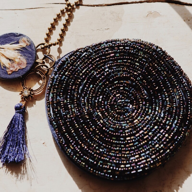 This handmade coin purse necklace is on a 36 inch chain!