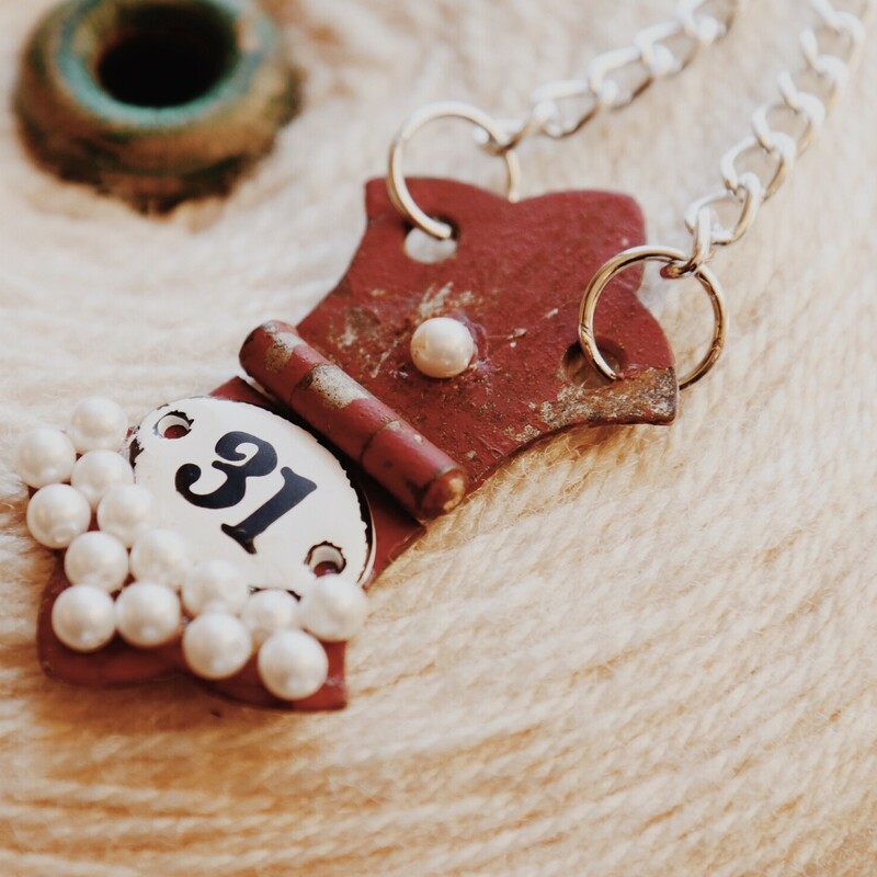 This adorable, handmade necklace is on a 32 inch chain!