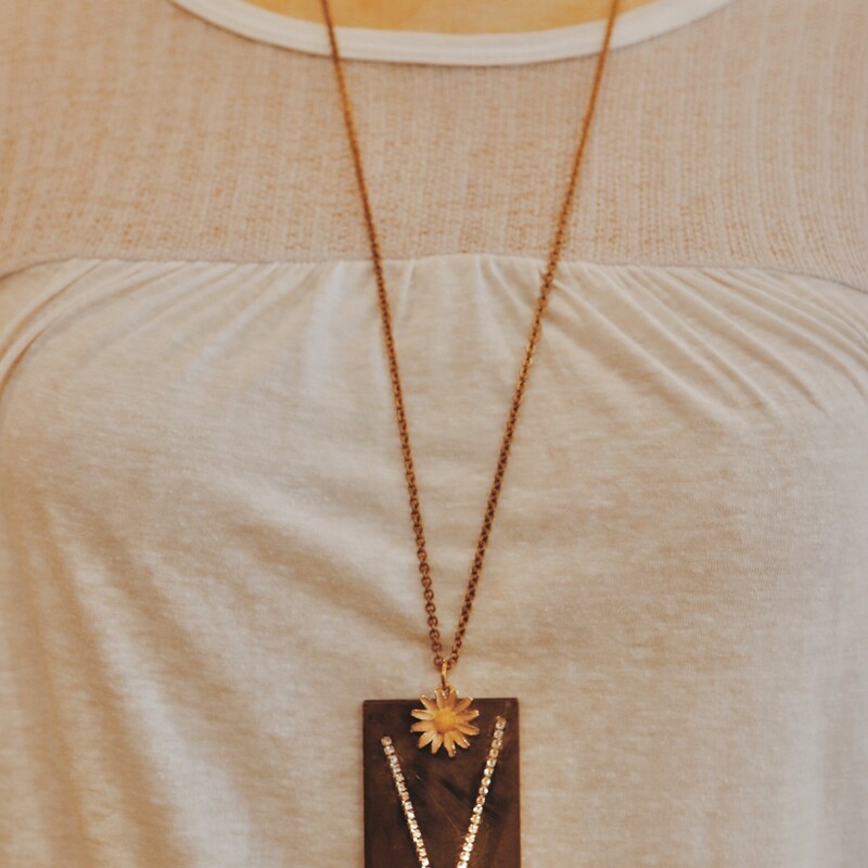 This handmade necklace has a V rhinestone engraved brass plate and is on a 32 inch chain!