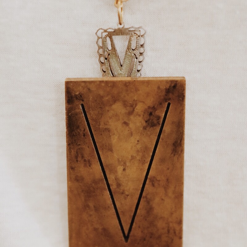This handmade necklace has a V engraved brass plate and is on a 34 inch chain!