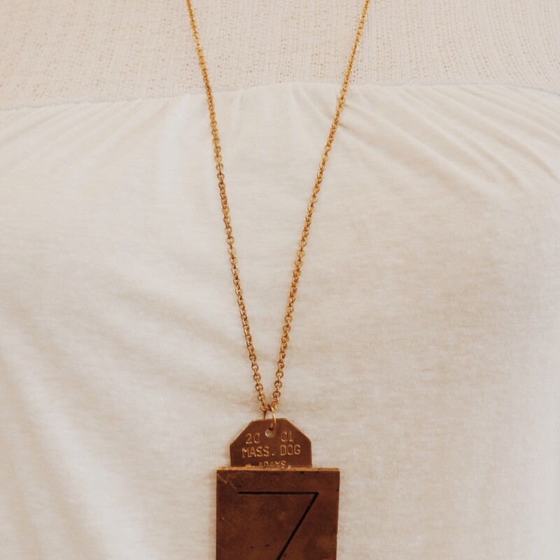 This handmade necklace has a Z engraved brass plate and is on a 32 inch chain!