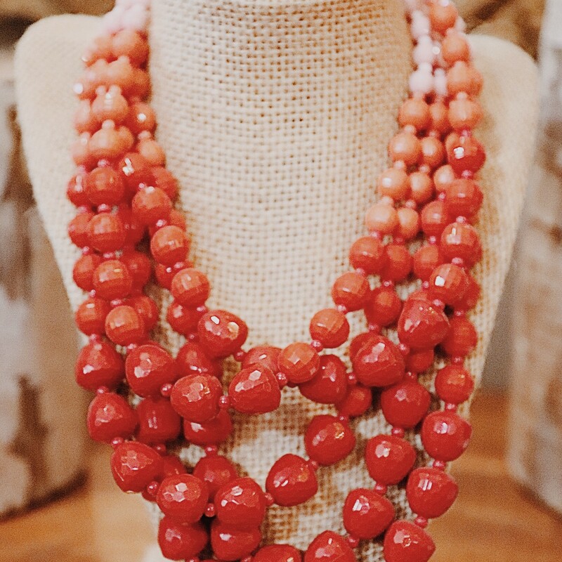 Red Shades Beaded Necklace, 5 layered beaded chains that fade from pink. peach, to red. The longest layer is 10 inches the shortest layer in 7.5 inches