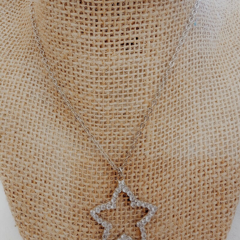 Silver Star Necklace, the necklace is made of chain with a star pendant. The chain measures 8.5 inches and the pendant is 1 inch long.