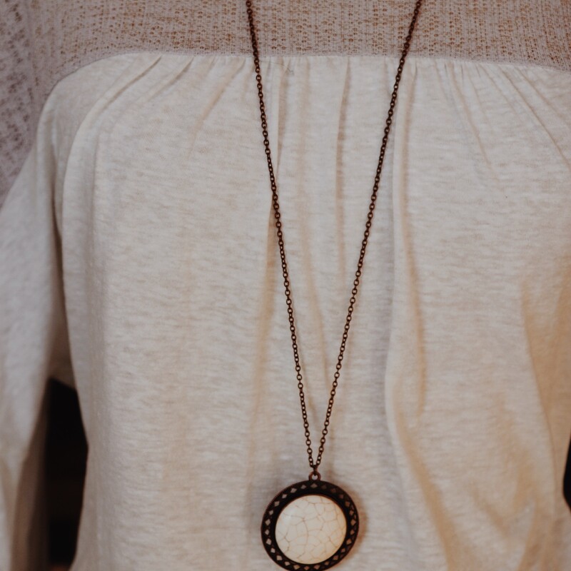 This lovely ivory stoned necklace is on a 38 inch chain with a 2.5 inch extender. Perfect for layering or throwing on and heading out the door!