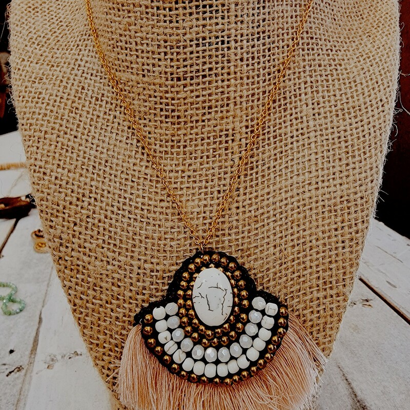 This adorable fringe necklace is on a 20 inch chain with a 2 inch extender!