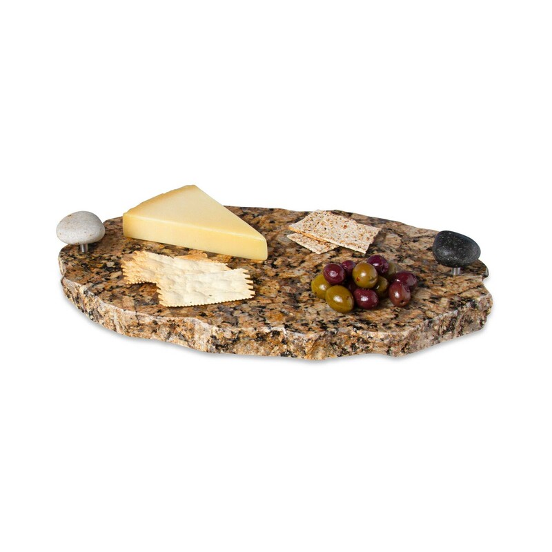 Granite Lazy Susan with Rock Handles<br />
<br />
Our Chillable Serving Tray with Lazy Susan is a solid piece of natural, reclaimed granite that is handcrafted into a unique, functional serving platter.  Each Chillable Serving Tray is built to last and features two smooth beach stone handles that make carrying a breeze and a high quality ball bearing turntable.  Each piece of thick granite has its own color and beauty, making each one of a kind. Includes a wooden serving knife.<br />
<br />
Measures approximately 15inX 10in X 2in high, 3in high<br />
including stone handles.<br />
<br />
It spins smoothly that everyone can reach their favorite item!