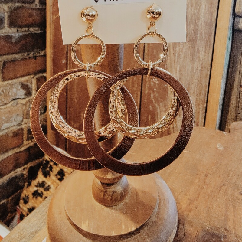 Wood Earrings hooped together with golden metal circles. Measuring 3.25 inches.