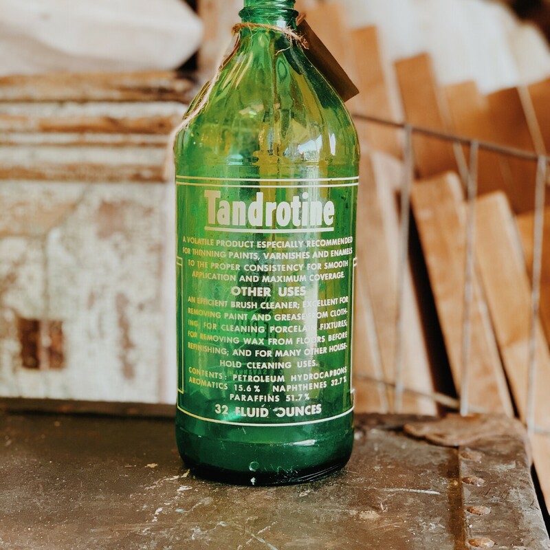 This vintage, glass Tandrotine paint thinner bottle measures 9 inches tall by 3.5 inches wide!