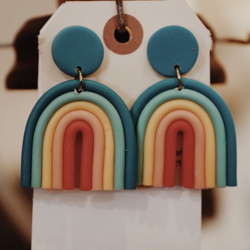 Rainbow Earrings composed of different shades of a rubbery material. Measuring 2.25 inches long.
