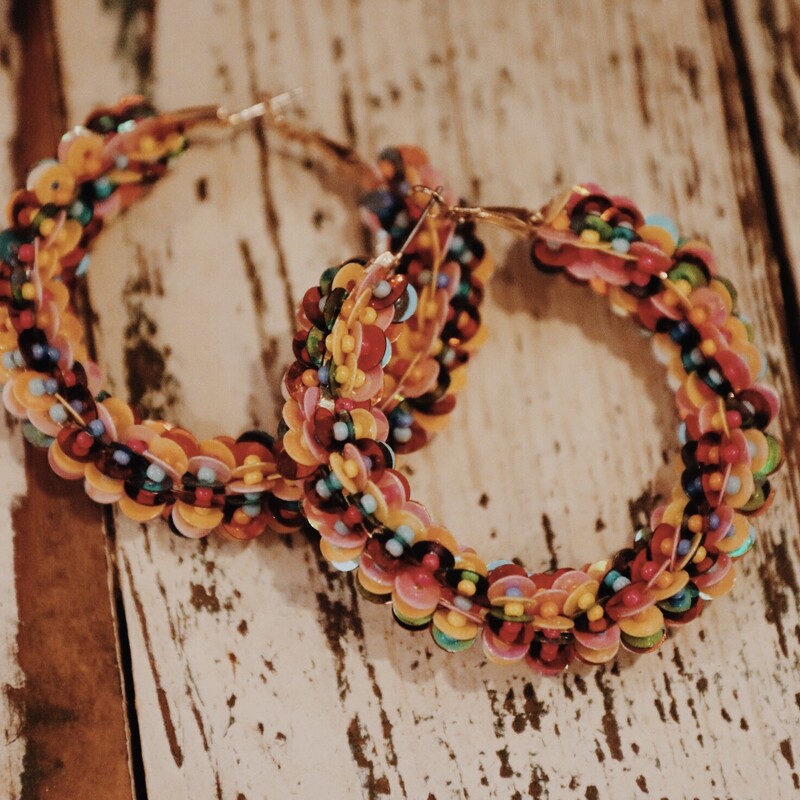 These bright and bold hoops are perfect for adding a pop of color to your outfit! The measure 2 inches long.
