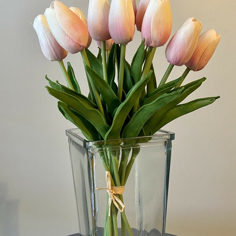 These beautiful real touch tulips are absolutely stunning! They look and feel like a real, live dozen of tulips! Use these as a gift, or fill your empty vases with a gorgeous flower that you don't have to water! They measure 14 inches long and come in a bunch of 12.