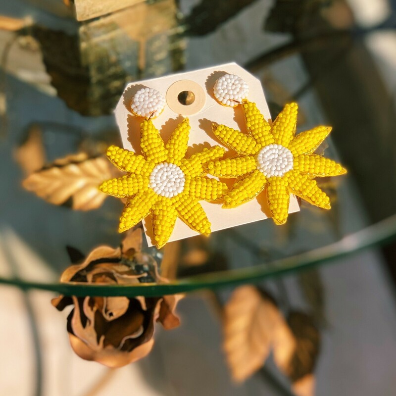 These adorable, bright yellow flower earrings measure about 2.5 inches long!