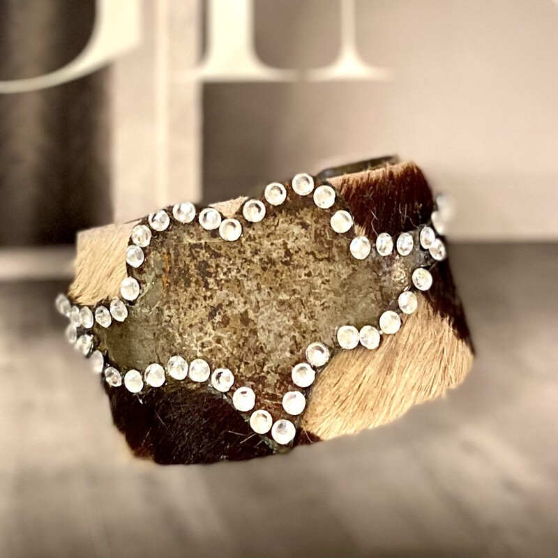Handmade cowhide cuff bracelet adorned with a funky rustic winged heart with rhinestones.