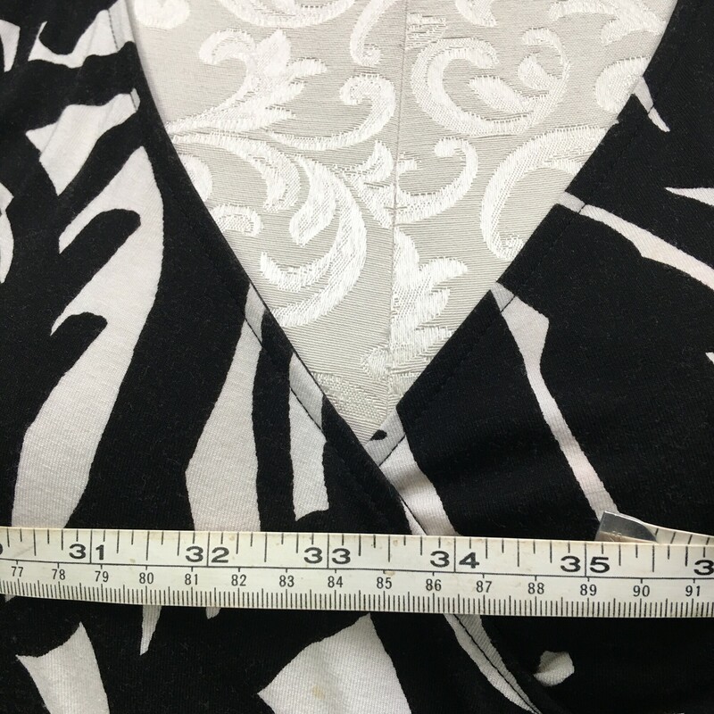 Ann Taylor, Pattern, Size: Petite,  jersey pullover  black and white print v neck knee length a line dress, unlined. No fabric tags, see photos for measurements. There is a very small stainnoted with blue tape in photo. Best guess this is a poly blend, by hand or machine wash gentle cold spearates, line dry.