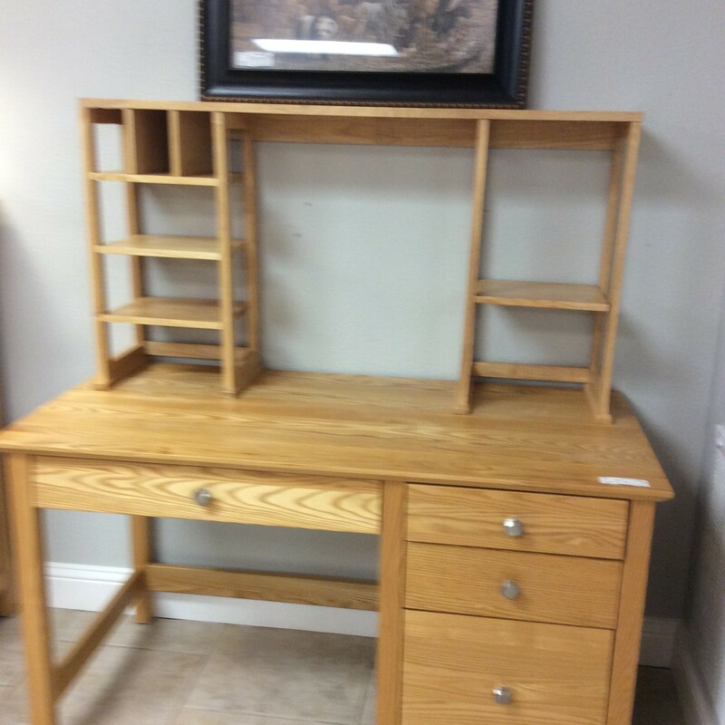 This is a very nice and functional children's desk. It features a light wood finish, drawers with dovetail jointing, cubbies and several mail slots.