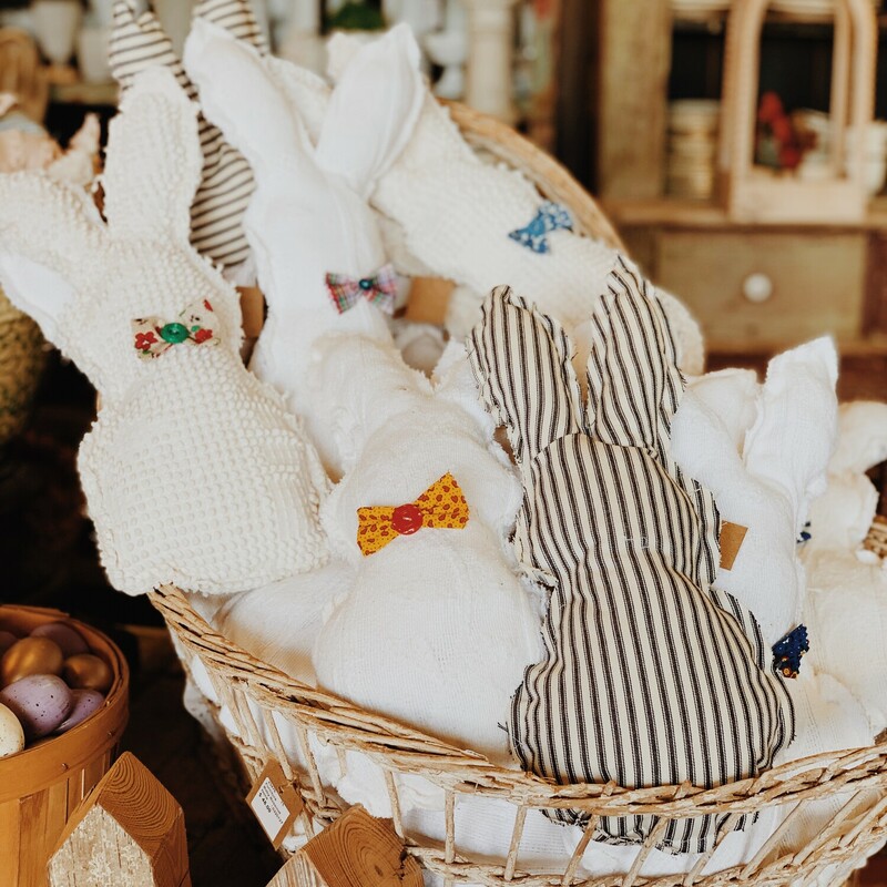 These adorable, handmade bunny rabbits were made from vintage fabrics! The fabric of the bowties differs from rabbit to rabbit with no two exactly the same. These measure about 16 inches long. They are available in navy ticking stripes, chenille, and cream fabric!