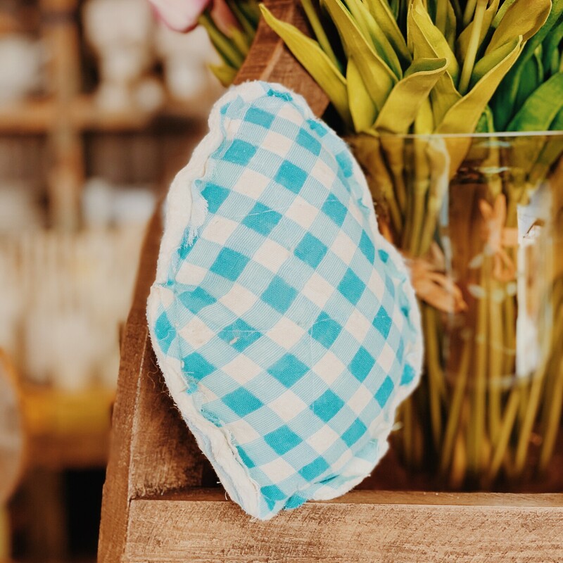 These adorable, decorative eggs were handmade from vintage fabrics! They measure about 8 by 5 inches.