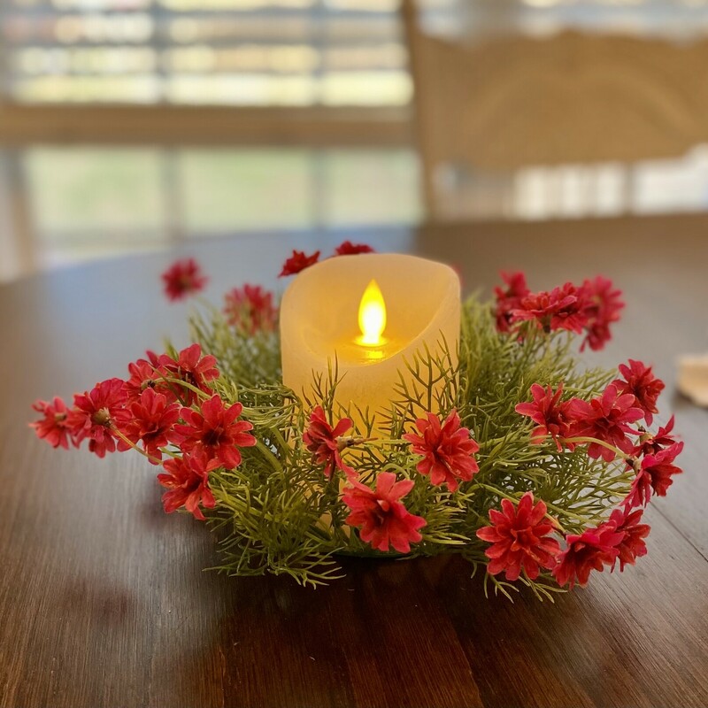 The star daisy ring features bright cerise pink flowers with greenery and wispy leaves.  The ring is perfect for accenting pillars and candle holders or even just sitting  by itself on a table.  This ring measures 3 inches inner diameter and 6 inches outer diameter.  This sweet candle ring is a perfect addition to your spring decor