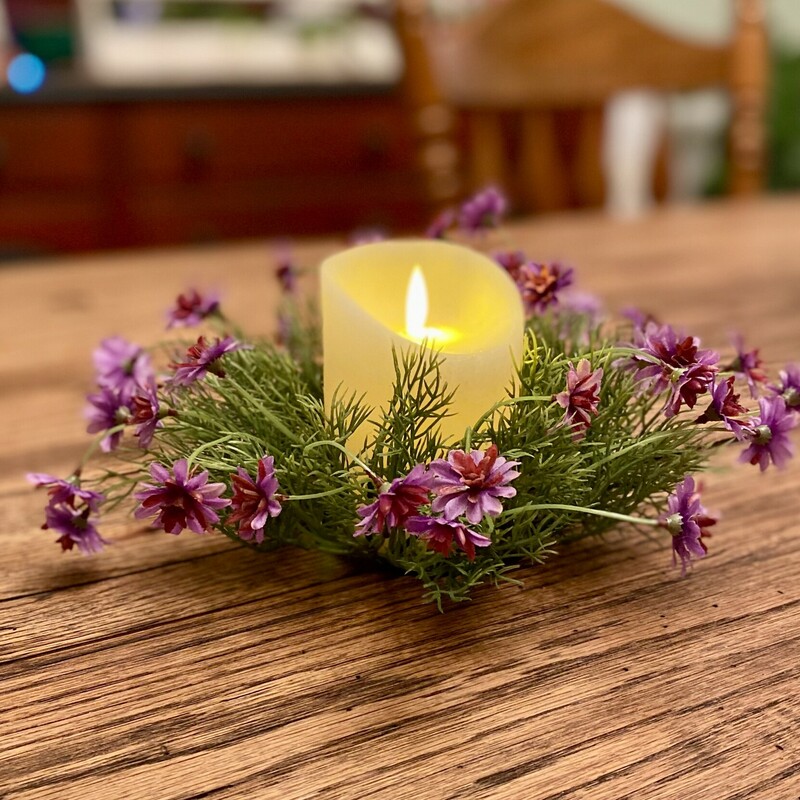 This beautiful; delicate star daisy candle ring has pretty purple and magenta flowers and  airy vine-like greenery with wispy leaves.  This ring is perfect for candles holders and pillars.  The inner of this ring is 3 inches in diameter with an approximately 6 inch outer diameter.