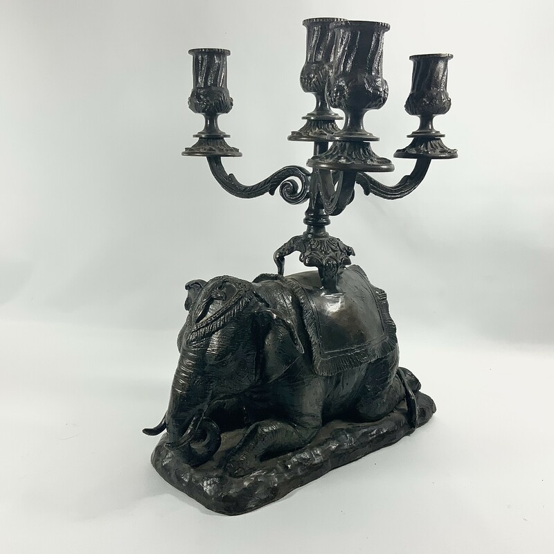 Beautifully crafted kneeling elephant candelabra 13.5 inches high 11 inches wide 10 inches deep.