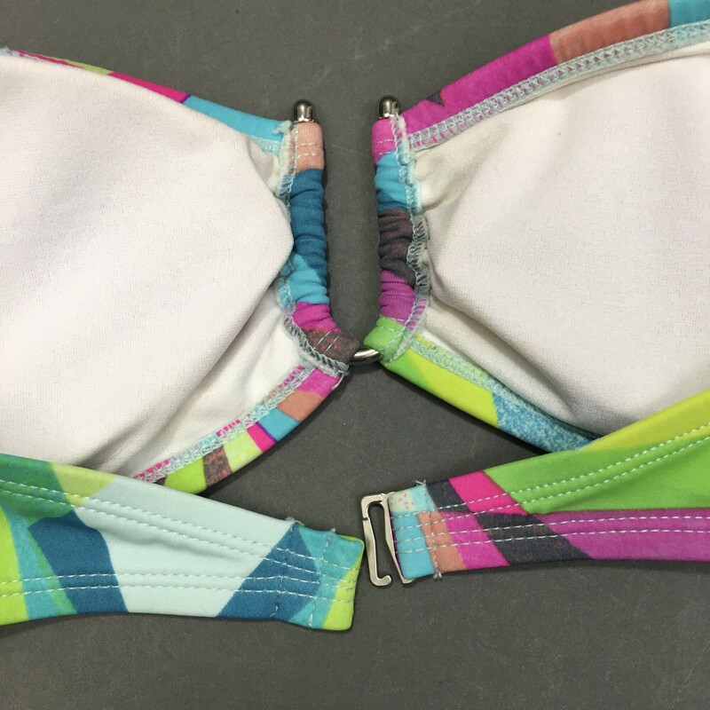 103-221 Kirra, Multicolor, Size M. 2 piece. Geometric aqua and green pattern bandeau style strapless top, with cute U shape joining hardware, and soft removeable cups. bikini bottom is classic low cut with ruche side fabric.  suit is fully lined, 80% nylon, 20% spandex, hand wash cold no bleach line dry in shade Made in Vietnam