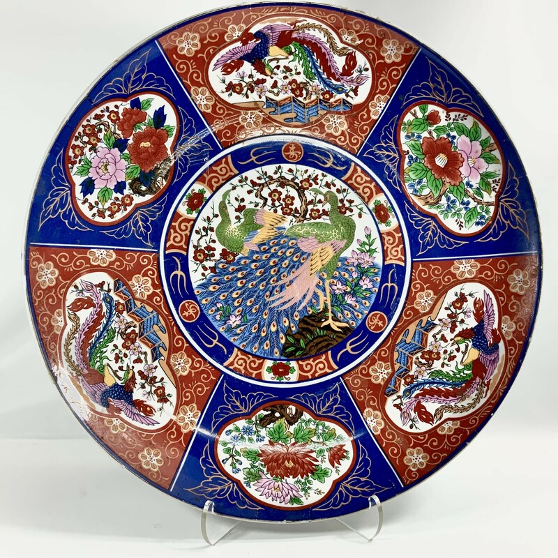Made in the 1960s beautiful Chinese Imari Porcelain Platter  A great decorative piece featuring a geometric design of alternating bird and floral patterns and striking blue and red colors
18 inch diameter Fair condition no visible chips but shows scratches paint loss stains See photos