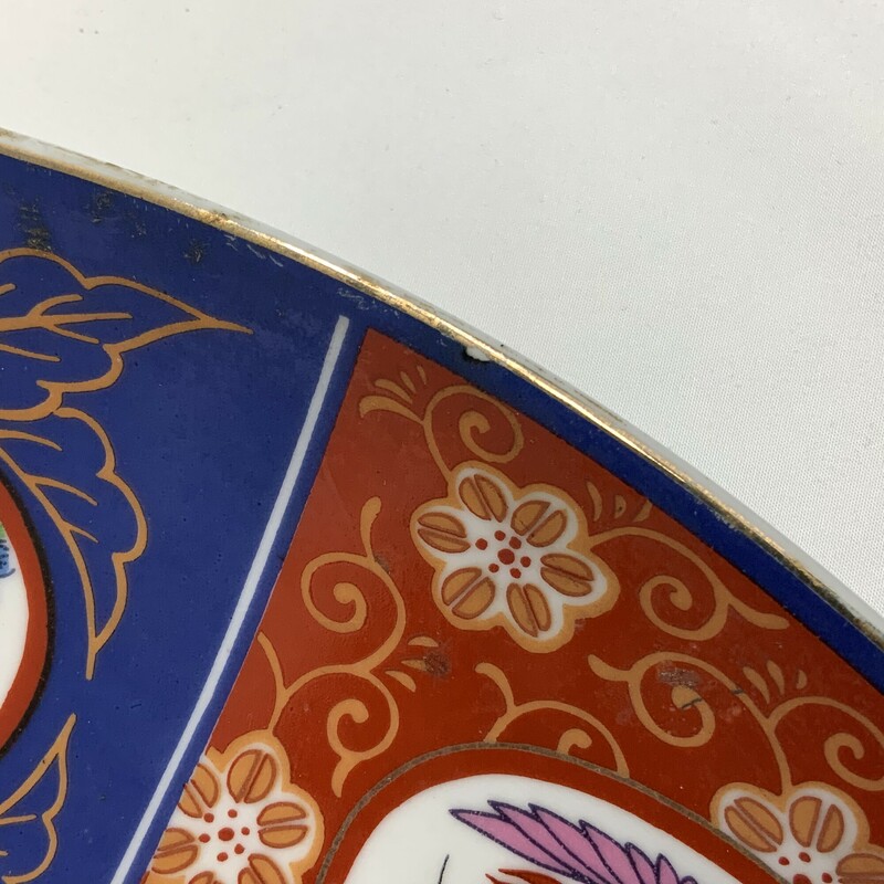 Made in the 1960s beautiful Chinese Imari Porcelain Platter  A great decorative piece featuring a geometric design of alternating bird and floral patterns and striking blue and red colors
18 inch diameter Fair condition no visible chips but shows scratches paint loss stains See photos