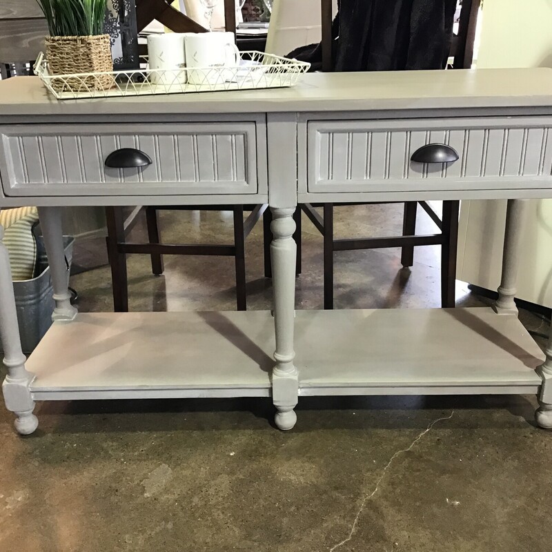 She did it again!  Our Local Artist painted this Broyhill Console Table using Country Chic Driftwood paint.  This table features:  painted on all four sides, a lower shelf and two drawers.

Dimensions:  52x18x30