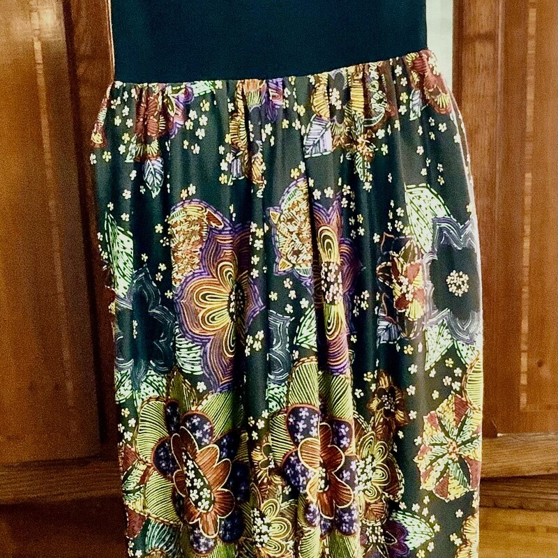 Sleeveless. Nylon blend.
Black with red orange yellow white purple and green floral pattern.
Black collar and waist.
Back zipper. Some repairs made.