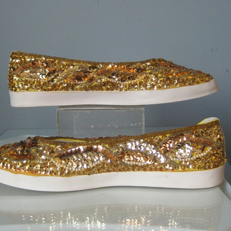 Super fun slip on sneakers by chinese laundry<br />
1990s era totally covered with really bright gold shiny sequins.<br />
by Chinese Laundry<br />
size 7.5<br />
excellent pre-owned condition, don't mind that hanging sequin in the back!  I've already fixed it.<br />
(just didn't notice it until I was taking the close up photo)<br />
<br />
thanks for looking!<br />
#45539